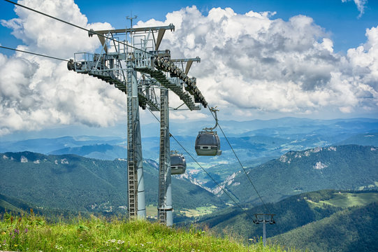 Cable car from Vratna dolina ( Vratna walley ) to Chleb mountain, Mala Fatra mountain range ( Carpathians ), Slovakia, Europe - cablewy and beautiful scenery of peaks and dramatic clouds