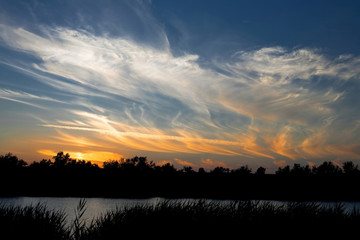 Obraz premium sunset over the river