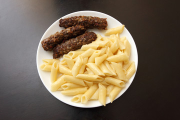 burgers and pasta on a plate