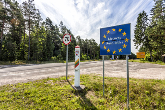Lithuania country border sign between Latvia and Lithuania with coat of arms and flag. EU flag sign with lithuanian text the Republic of Lithuania.