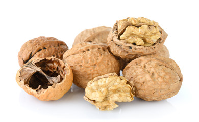 walnut and a cracked walnut isolated on the white background
