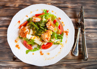 Tasty shrimps salad green beans and cherry tomatoes. Top view