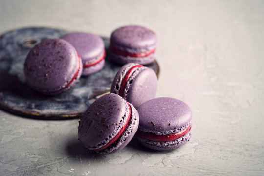 French macarons on a gray table