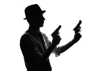 Silhouette of detective with two guns