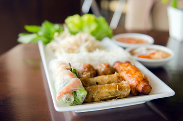 Spring roll with pork, fried shrimp with sugar cane and vegetabl