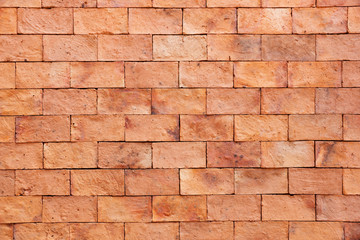 Fototapeta premium Background texture of the new red brick wall.