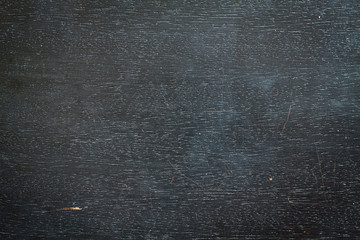 Black wooden background. Place for text.