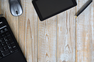 Close up of a wooden table bureau at the office with laptop, computer, mouse, fontain pen  and...