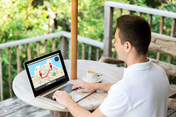 close up of businessman with laptop on terrace