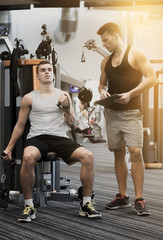 man exercising on gym machine