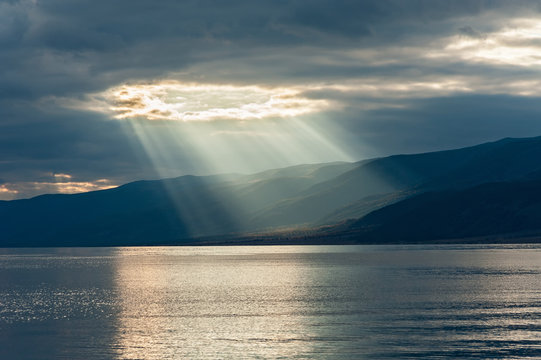 the rays of the sun passing through the clouds
