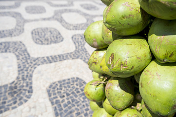 Bunch of fresh green Brazilian coco verde coconuts hanging at Ipanema Beach boardwalk Rio de Janeiro Brazil
