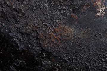 The bottom of the old cast-iron frying pan
