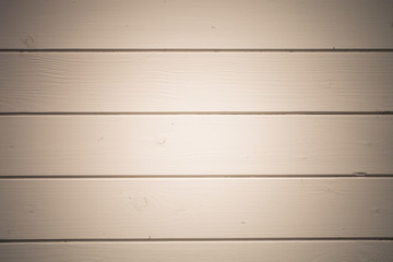 Rustic wooden houses painted wall. Closeup view. Selective focus