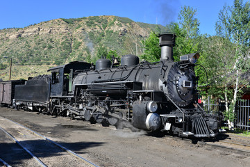 Fototapeta na wymiar A 19th century American steam engine at a siding in Durango.