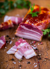 Bacon. Smoked bacon parsley herb salt pepper and garlic.Stll life studio shot.