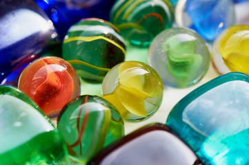 Fototapeta na wymiar Colorful glass colorful square and round stones. Macro
