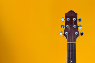 guitar headstock on yellow background