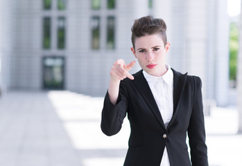 Modern business woman pointing