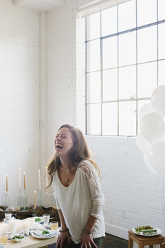 A woman laughing.