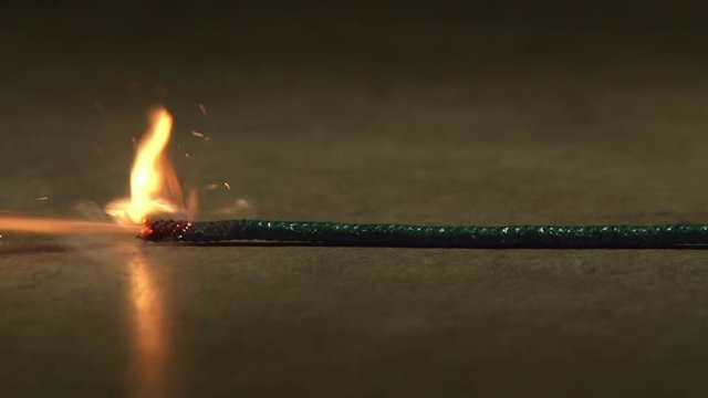 A fuse being lit and burning.