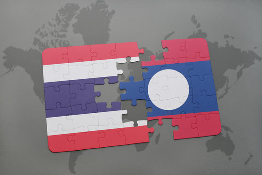 puzzle with the national flag of thailand and laos on a world map background.