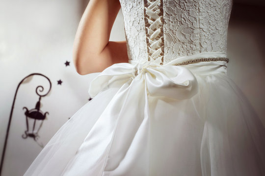 A closeup image of wedding preparations. Bride in dress