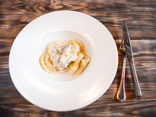 Russian cottage cheese dumplings vareniki with fresh sour cream