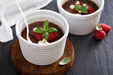 Chocolate pudding with raspberries and basil