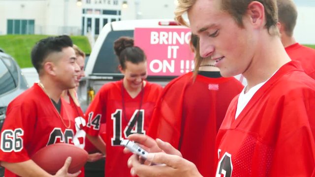 Tailgate: Guy Calls Friend Over To Look At Stats On Football Game