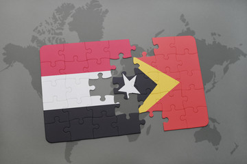 puzzle with the national flag of yemen and east timor on a world map background.