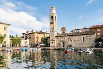 Fototapeta na wymiar Small, romantic port in Lazise at Lake Garda in Italy