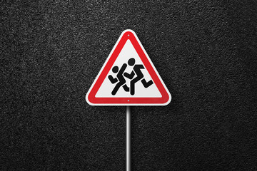 Road sign triangular shape with a picture of a children on a background of asphalt. The texture of the tarmac, top view.