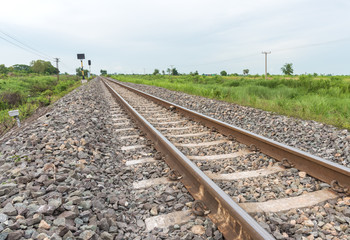 Fototapeta na wymiar Railroad tracks leading from right to left