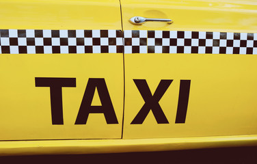 The side of New York City yellow taxi cab
