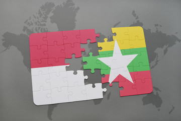 puzzle with the national flag of indonesia and myanmar on a world map background.