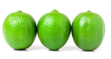 three lime isolated on white background close up