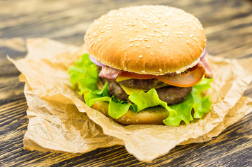 Closeup of homemade hamburger with fresh vegetables