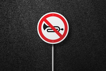 Road sign circular shape with a picture of the musical instrument on a background of asphalt. The...