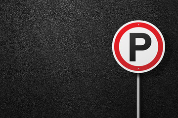 Road sign circular shape on a background of asphalt. Parking. The texture of the tarmac, top view.