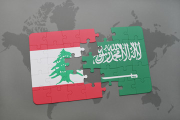 puzzle with the national flag of lebanon and saudi arabia on a world map background.