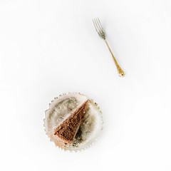 Breakfast composition with cakes on golden vintage tray and fork on with background. Flat lay, top view