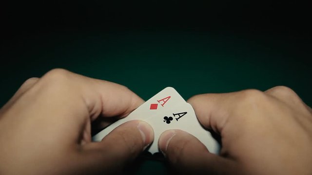 A pair of aces in a hand on the table. Pocker