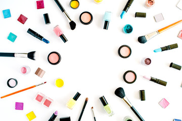 flat lay female cosmetics collage frame with lipstick, brush on white background. top view set