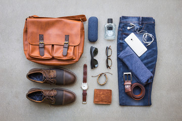 Men's casual outfits with accessories on gray grunge background