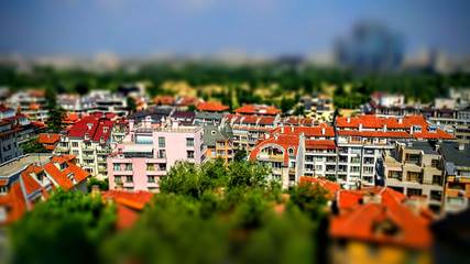 Tilt-shift panoramic effect photo of cityscape with residential buildings