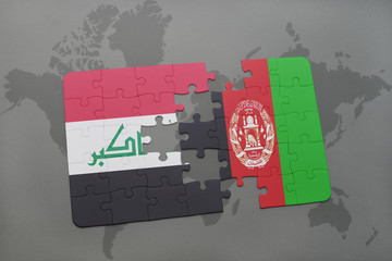 puzzle with the national flag of iraq and afghanistan on a world map background.