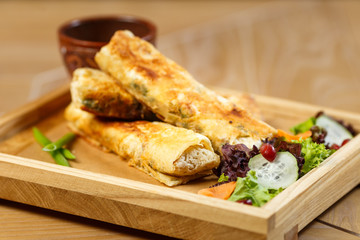 Beautiful meat dish on a wooden background