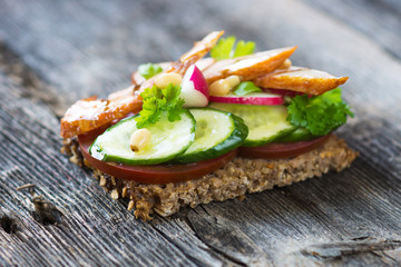 Delicious sandwich with grilled chicken and fresh crunchy vegetables