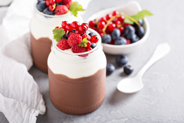 Chocolate pudding with cream and fresh berries